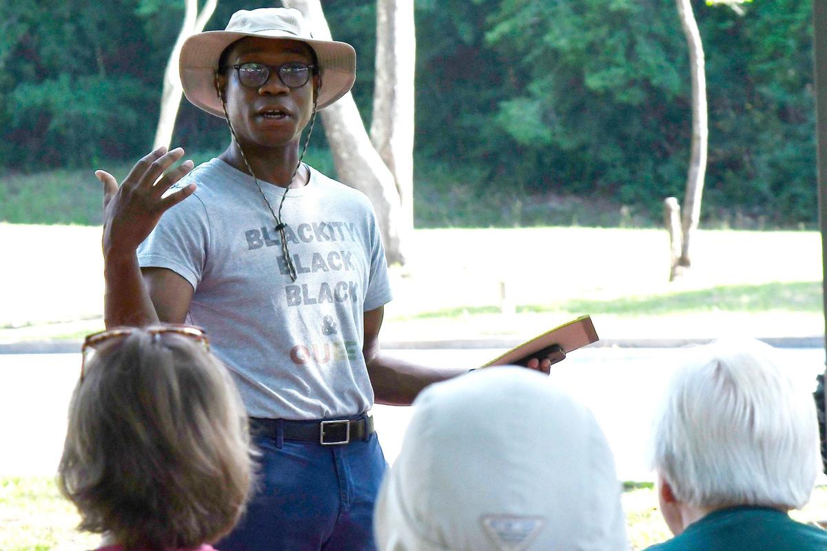 Macon Pride board member and LGBTQ+ activist DeMarcus Beckham speaks before the start of the Pride in Our Parks event on Saturday, June 8, 2024, at Ocmulgee Mounds National Historical Park in Macon, Georgia. Macon Pride partnered with Southern Queer Folk Hikes and Ocmulgee Mounds National Historical Park for the event to work on two citizen science projects assisting in park maintenance.