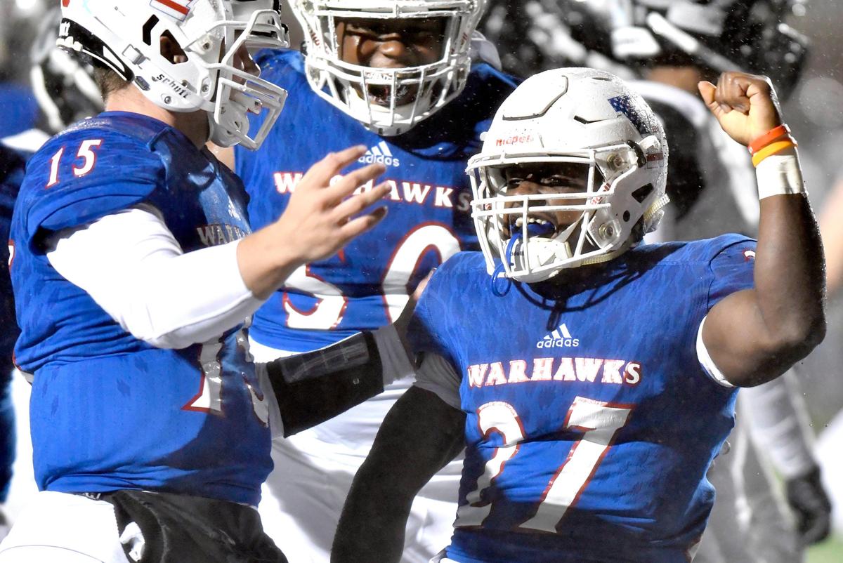 Veterans running back Julian Barnes (27) celebrates a first quarter touchdown during the Warhawks’ first round playoff game against Riverdale Nov. 15, 2019.