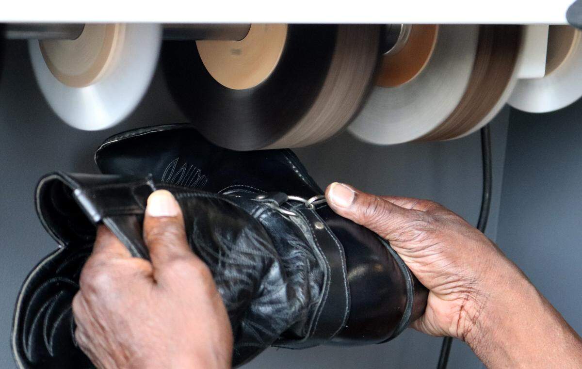 Eric Denton shines a shoe at MANicured Men’s Spa, an upscale men’s only grooming spa at 486 Poplar St. in downtown Macon.