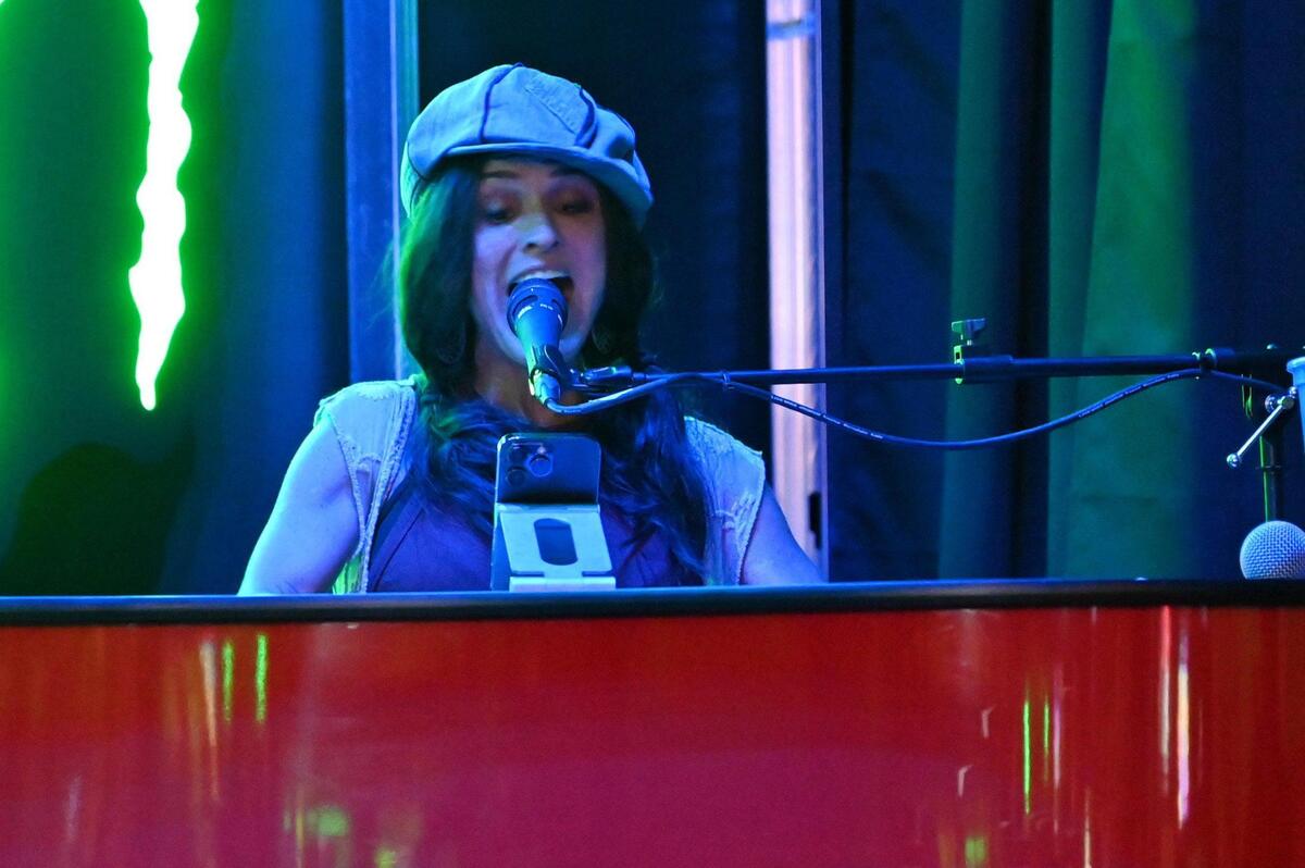 Guest pianist Tonya Scott, from Conyers, Georgia, play an audience requested song at 5ive70 Dueling Piano Bar in downtown Macon, Georgia. The new bar and live music venue features two pianists every weekend that play exclusively audience requested tunes of any genre.
