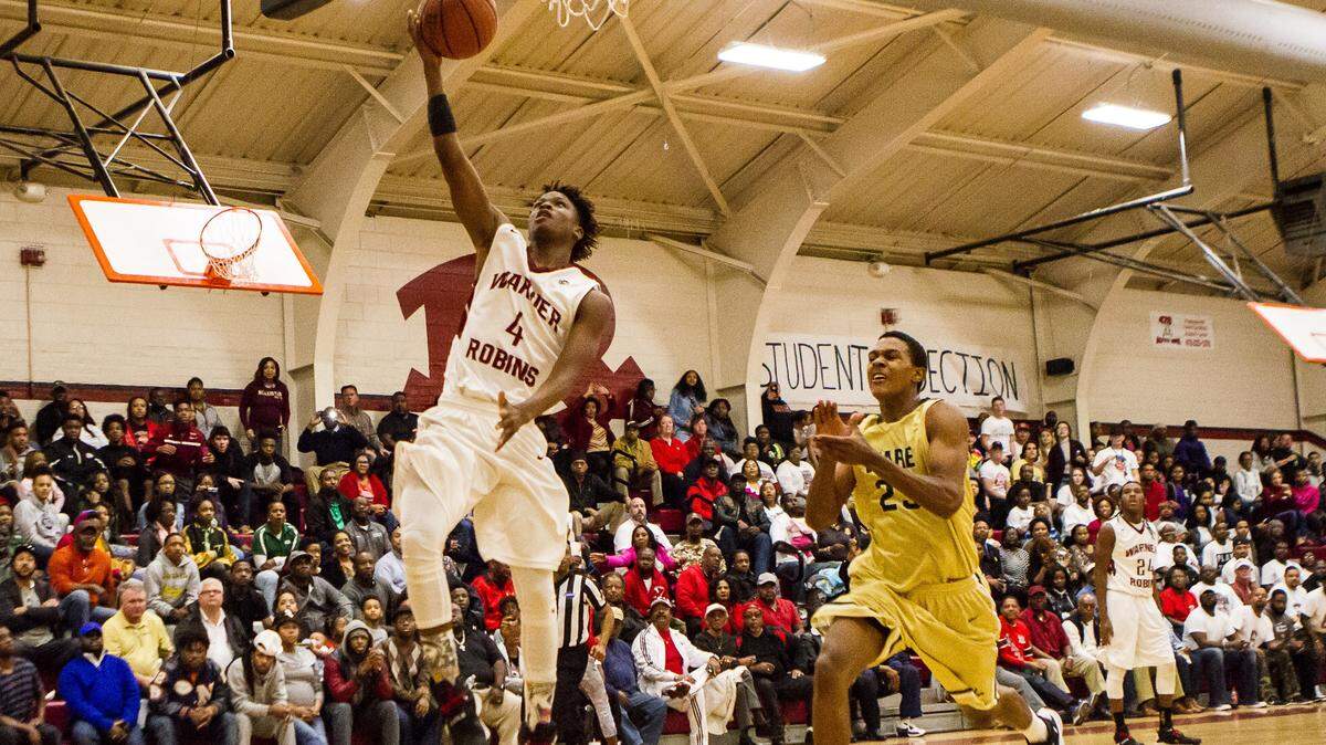 Warner Robins's Jacolbey Owens (4) and the Demons host