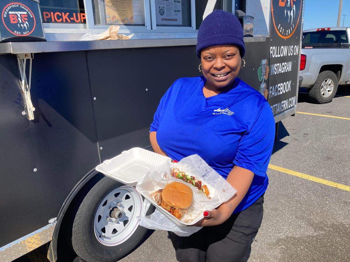 Isabella Smith ordered a kickin’ chicken sandwich and loaded tots from the Bearfoot Tavern food truck that set up recently in the parking lot of Lowe’s Home Improvement off Watson Boulevard in Warner Robins. She gave the meal a top rating of 5 out 5.