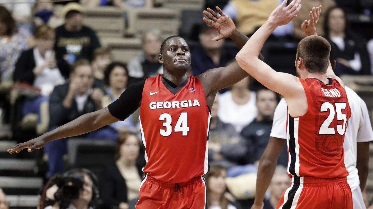 Georgia forward Derek Ogbeide (34) celebrates with Kenny Paul Geno (25) after a play against Vanderbilt during the first half Saturday in Nashville, Tennessee.
