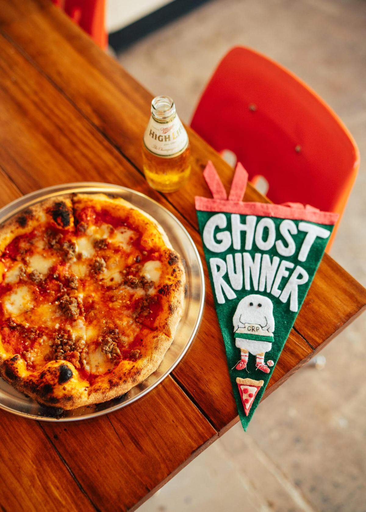 Sausage pizza with vodka sauce, mozzarella and sausage at Ghost Runner Pizza in historic downtown Perry.
