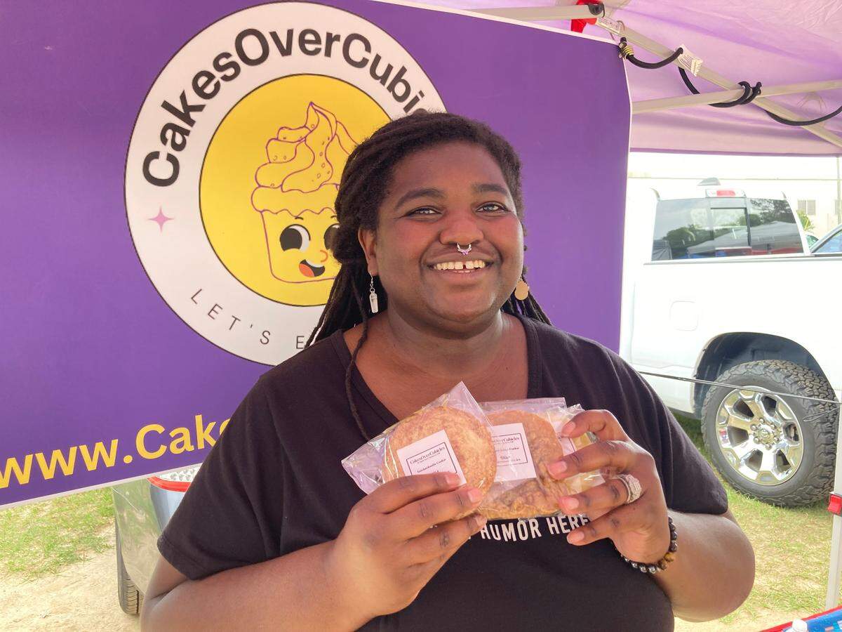 Maria Venable, owner of CakesOverCubicles, with cookies for sale at the International City Farmers Market in Warner Robins.