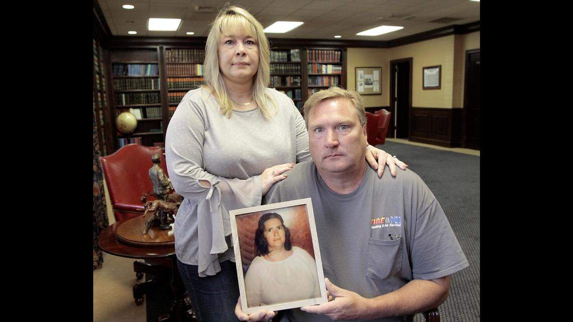 Joe Bowen, with his wife Edna, holds a photo of his late mom, Lottie Marilee Bowen, 70, of Macon. Bowen buried his mother after  funeral home owner gave him her ashes. But it wasn't his mom.
