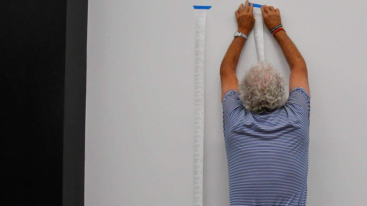 A poll worker prepares election results at the Bibb County Board of Elections office in Georgia on Tuesday, May 21, 2024. Two candidates have recently been disqualified from the presidential race in Georgia.