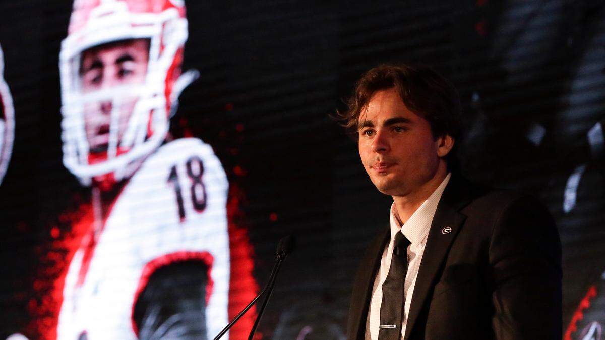 Georgia’s JT Daniels speaks to reporters during the NCAA college football Southeastern Conference Media Days Tuesday, July 20, 2021, in Hoover, Ala. (AP Photo/Butch Dill)