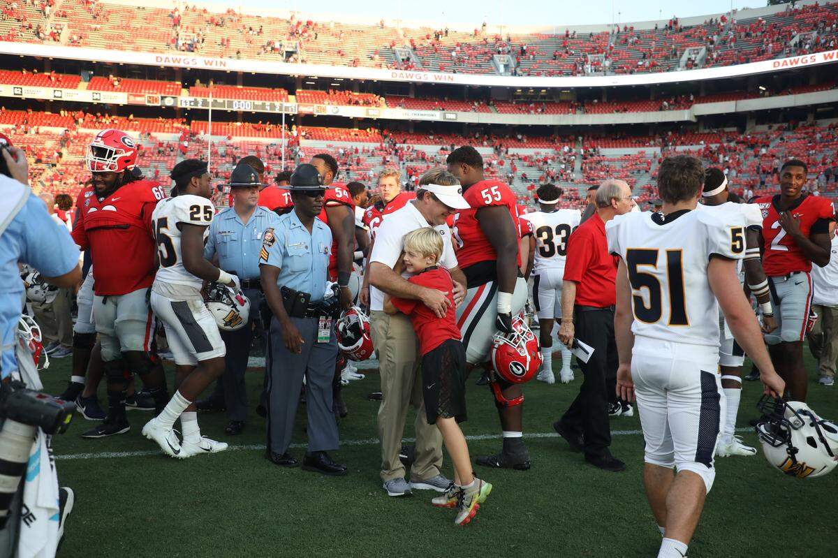 Georgia head coach Kirby Smart and his son during the Bulldogs’ game against the Murray State Racers on Dooley Field at Sanford Stadium in Athens, Ga., on Sat., Sept. 7, 2019.