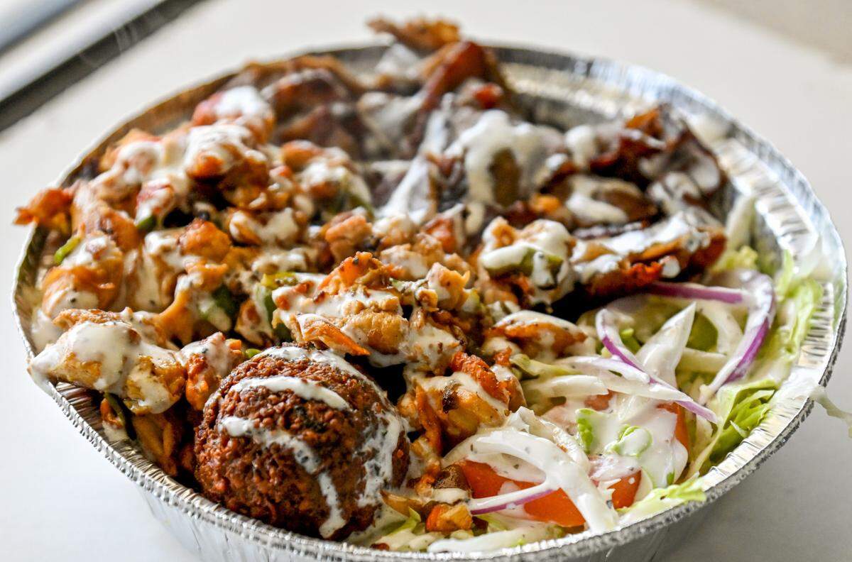 Mixed plate over rice at NYC Style Deli at 5033 Brookhaven Road, Suite 600, in Macon.