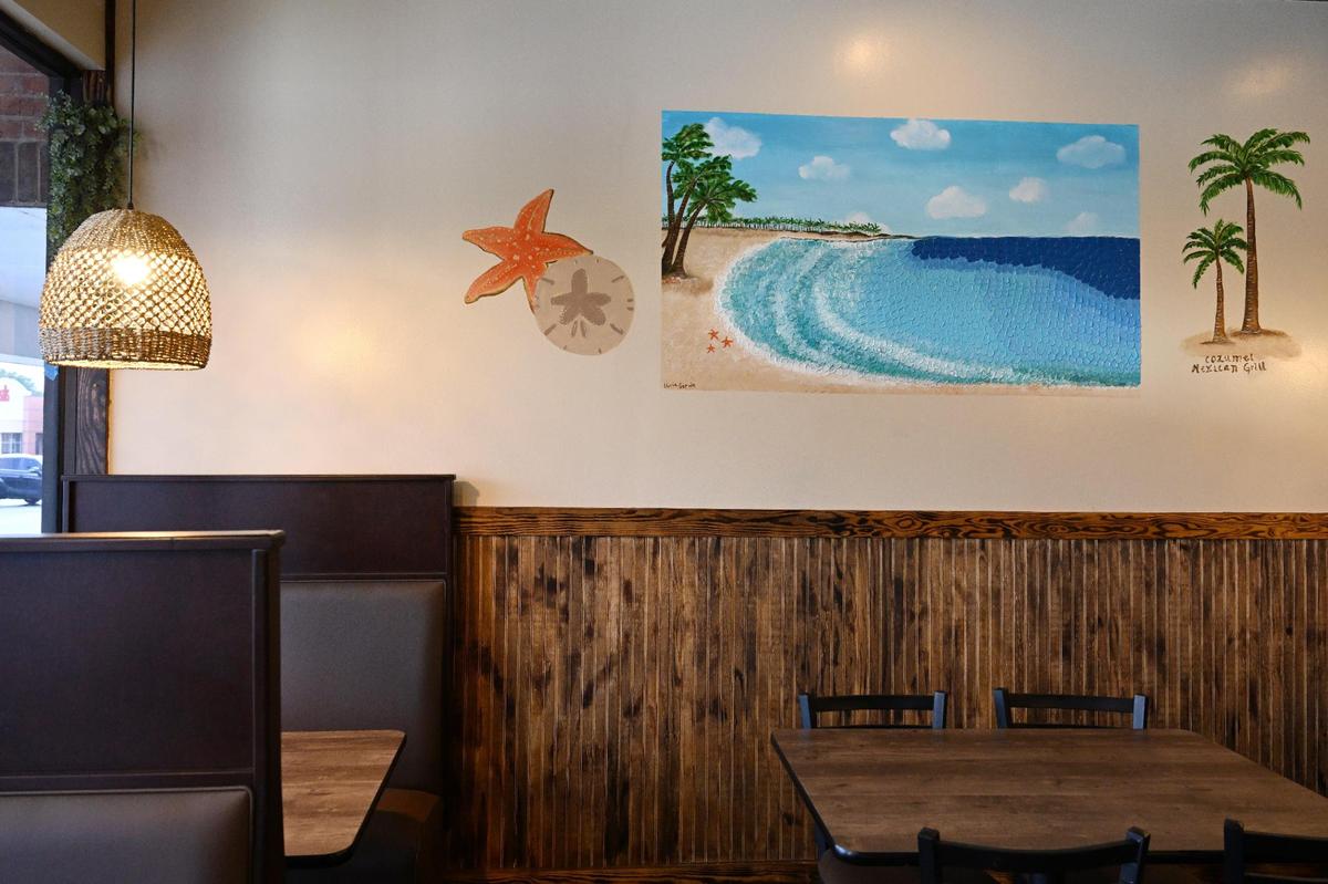 A beach painting on the wall inside of Cozumel Mexican Grill on Wednesday, April 23, 2025, in Perry. The mural was painted by Lluvia Servin, the 12-year-old daughter of restaurant partner Jazmin Esparza-Ortiz.