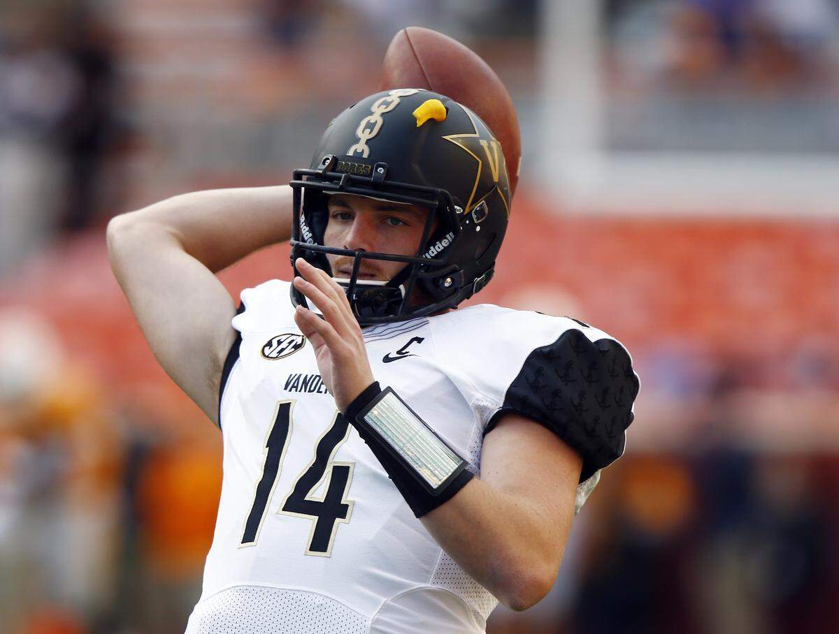 Vanderbilt quarterback Kyle Shurmur (14) throws to a receiver during warmups.