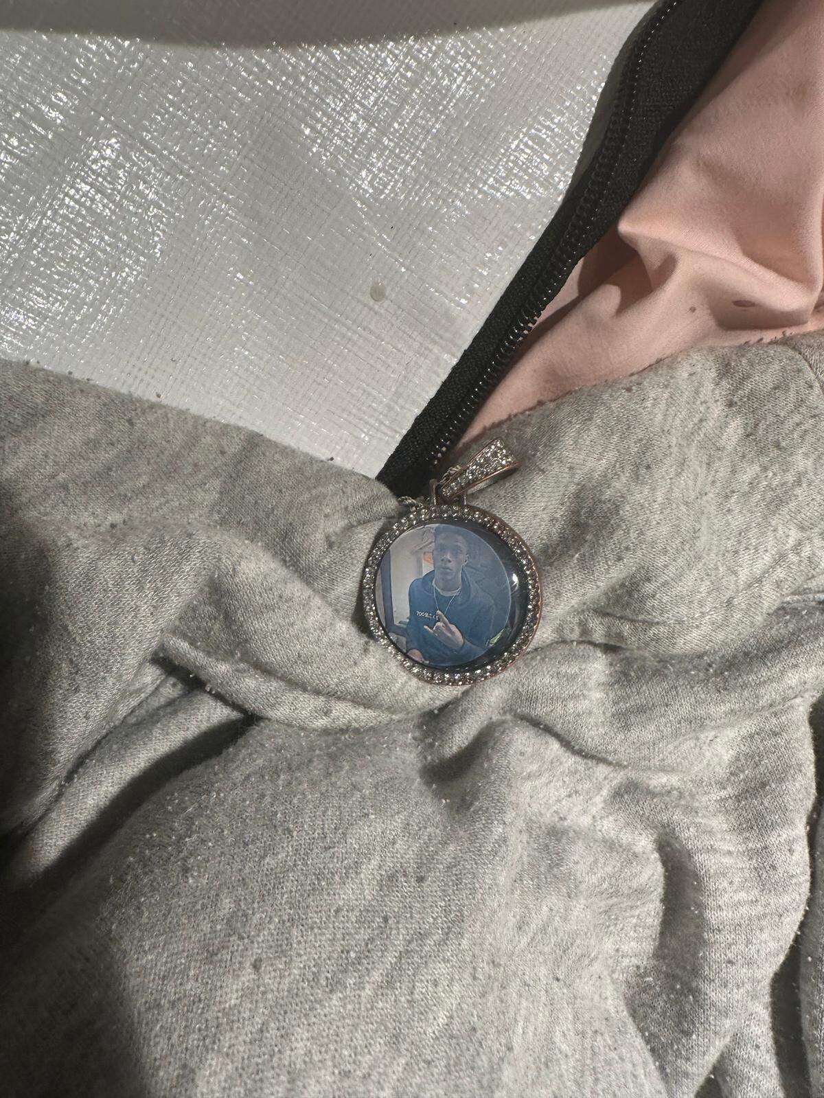 A necklace with a picture was found on the body of Derrick Putmon, 16, after he died from gunshot wounds on May 22. His mother saw the necklace on a local news website and identified him, coroner Leon Jones said.