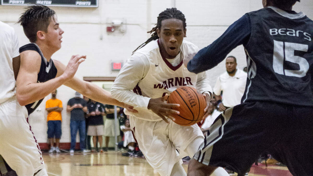 CLAY TEAGUE/FOR THE TELEGRAPHWarner Robins, GA, 12/11/15Warner Robins's Donovan Brown drives the lane against Houston County.