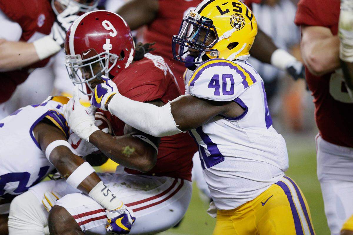 Alabama running back Bo Scarbrough is tackled by LSU linebacker Devin White in the two teams' meeting in 2017.