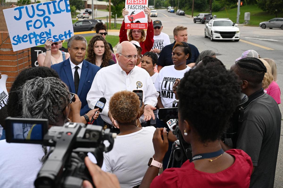 Bibb County Sheriff David Davis (middle) speaks with protesters about conditions in the Bibb County Jail outside of the Bibb County Sheriff’s Office on Wednesday, May 28, 2025, in Macon, Georgia. Davis acknowledged the need for jail reform while speaking with protesters and said that they should also pressure the mayor and county commissioners, even going so far as to joining protesters who marched to Macon City Hall asking to speak with Mayor Lester Miller.