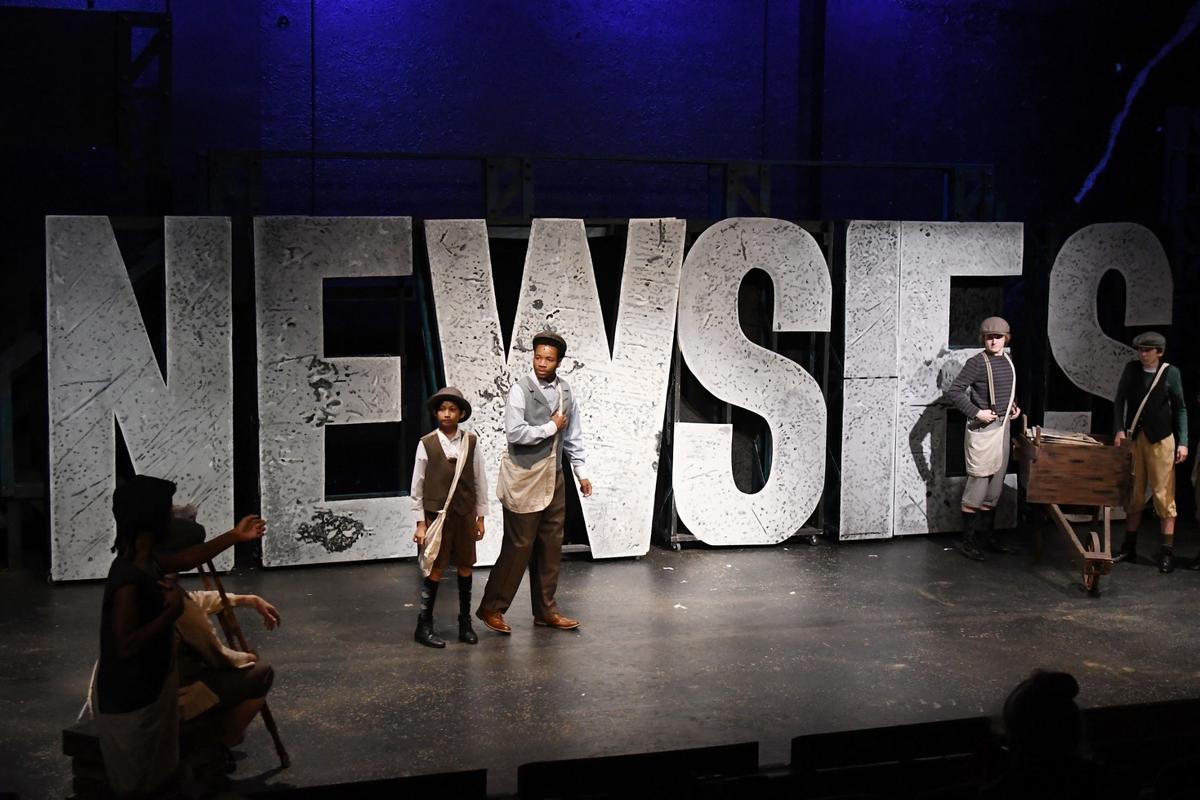 Max Posilero (left), performing as Les, and Jordan Ray, performing as Davey, walk across the stage during the first dress rehearsal on Tuesday, July 9, 2024, at Theatre Macon in Macon, Georgia. Theatre Macon’s “Newsies” will run from Friday, July 12 to Saturday, July 27.