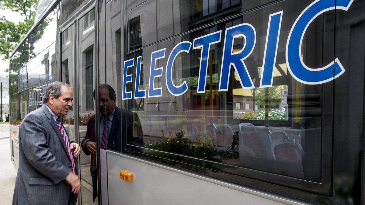 Mayor Robert Reichert checks out the BYD Coach and Bus electric bus in front of Terminal Station on Monday morning.