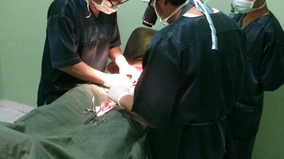 A team of doctors performs a vasectomy at the Nur Hidayah medical clinic outside Yogyakarta, Indonesia. Like many religiously-affiliated medical providers in Indonesia, the clinic offers extensive family planning services, including providing contraceptives and performing sterilizations.