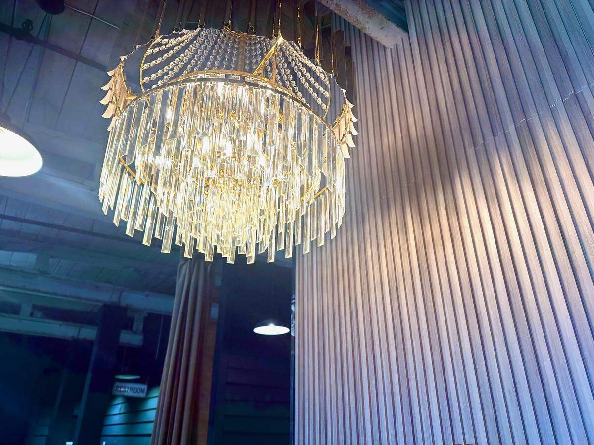 Delicate chandelier at Her Majesty Kitchen in Forsyth.