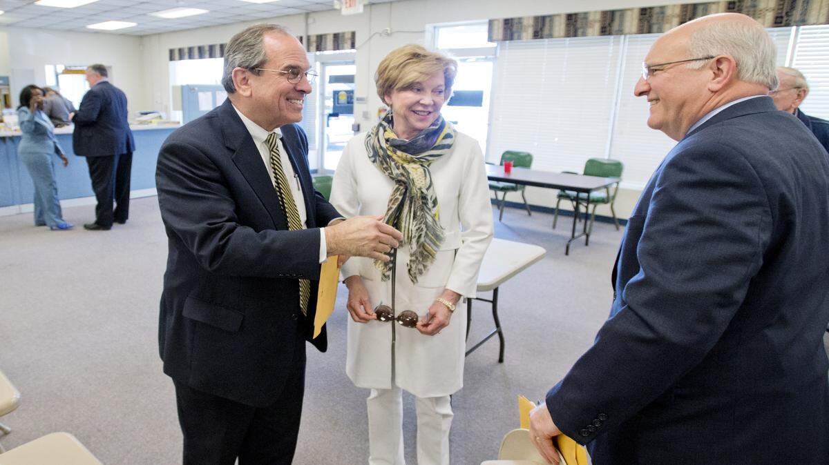 Macon-Bibb County Mayor Robert Reichert and Bibb County Sheriff David Davis greet one another at the Bibb County Board of Elections office during the first day of qualifying for the May 24 elections.