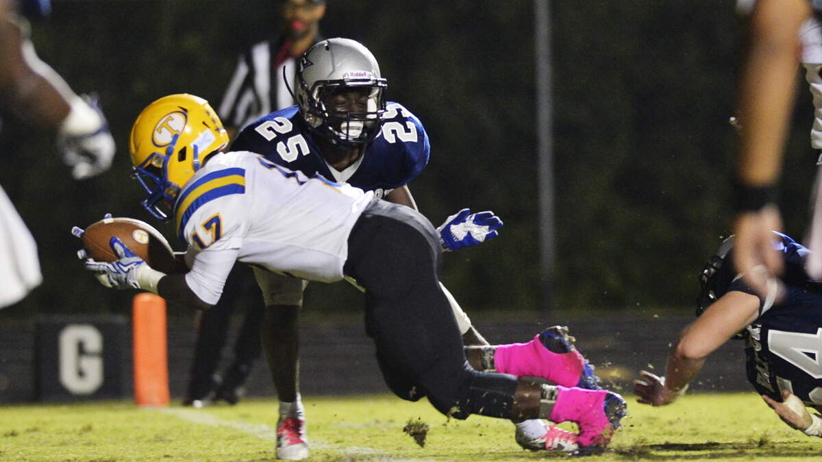BEAU CABELL/THE TELEGRAPH 
 Macon, Ga., 10/09/2015: Tattnall running back Zion Blasingame (17) dives into the end zone in front of Stratford's Jaylan Hughes (25) for the first touchdown of the game.