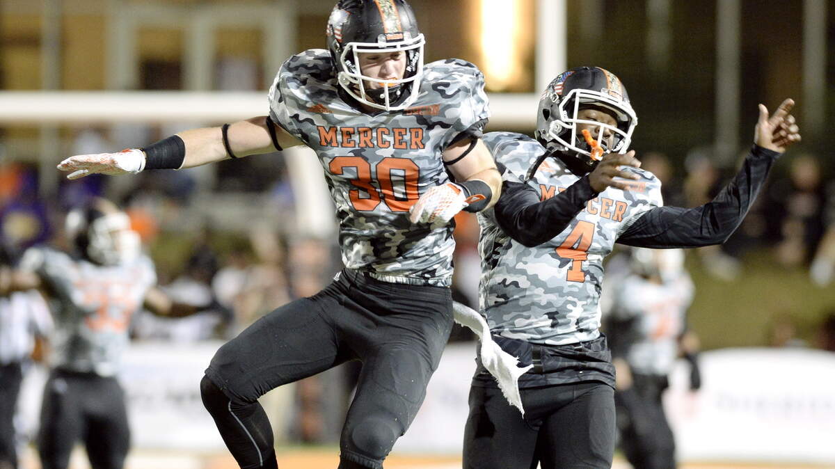 JASON VORHEES/THE TELEGRAPH Macon, GA, 11/07/2015: 
 Mercer defensive backs Mike Gray (30) and Sebastian Hicks (4) celebrate a Bears fumble recovery during their game against Chattanooga November 7.