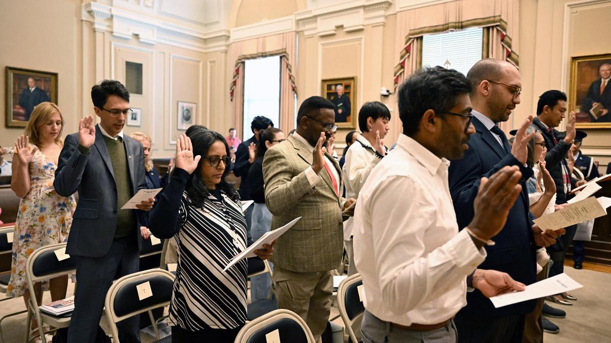 Petitioners recite the Oath of Allegiance during the conclusion of the naturalization ceremony at the United States District Court Middle District of Georgia on Wednesday, April 9, 2025, in Macon, Georgia. The 22 foreign nationals that petitioned for American citizenship represented 15 countries of origin in the annual ceremony that takes place every spring in Macon.