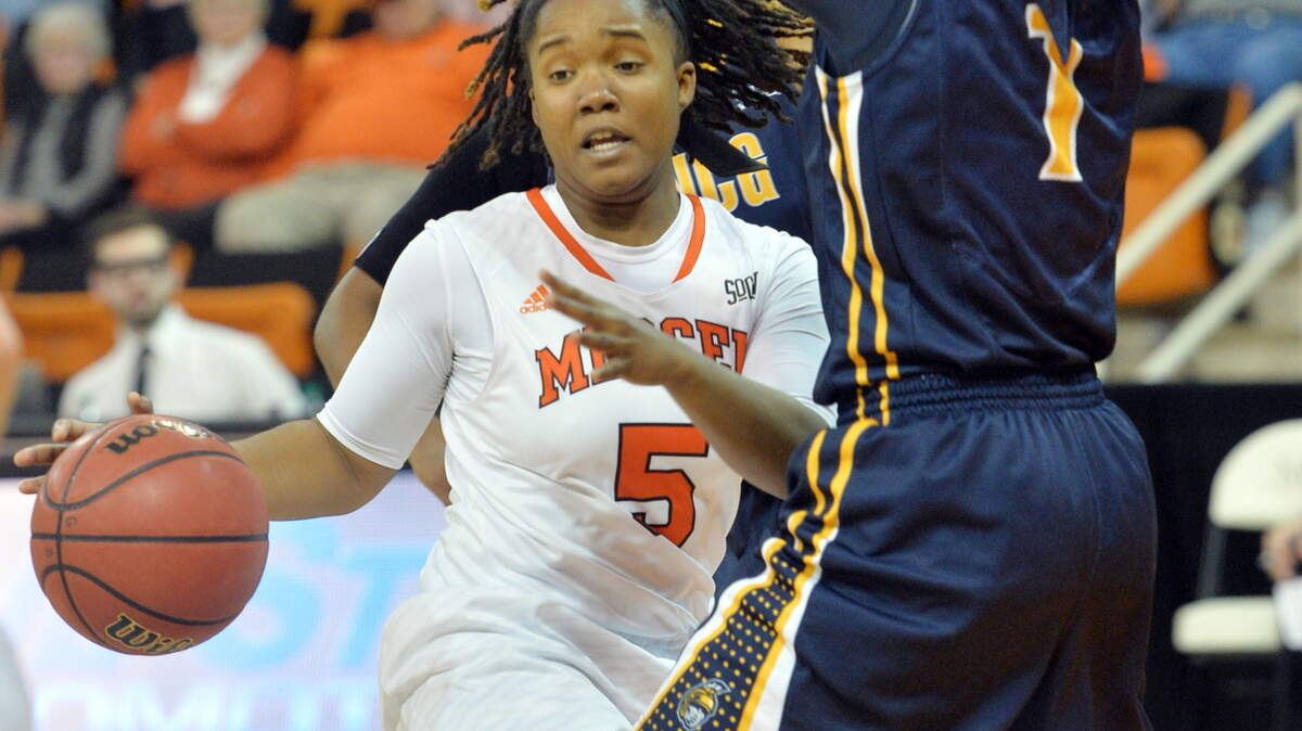 Mercer's Brittnee Broadway (5) runs into UNC Greensboro's Keli Foster during Saturday's game at Hawkins Arena.