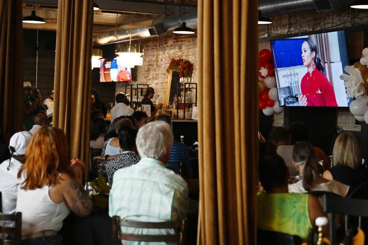Friends and family of Forsyth chef Chelsia Green Ogletree watch her appearance on “Chopped” during a private watch party on Tuesday, July 8, 2025, at Her Majesty Kitchen in Forsyth, Georgia. Ogletree won the competition out of four chefs from across the country and a $10,000 prize.