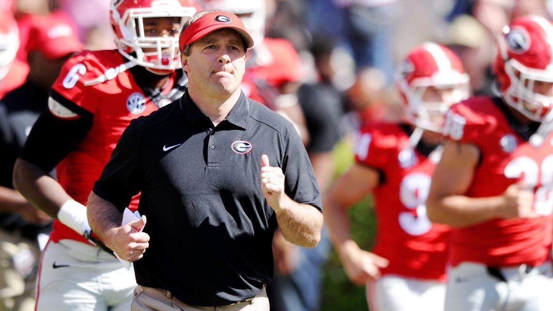 Georgia head coach Kirby Smart leads his team out for the G-Day spring game in 2016.