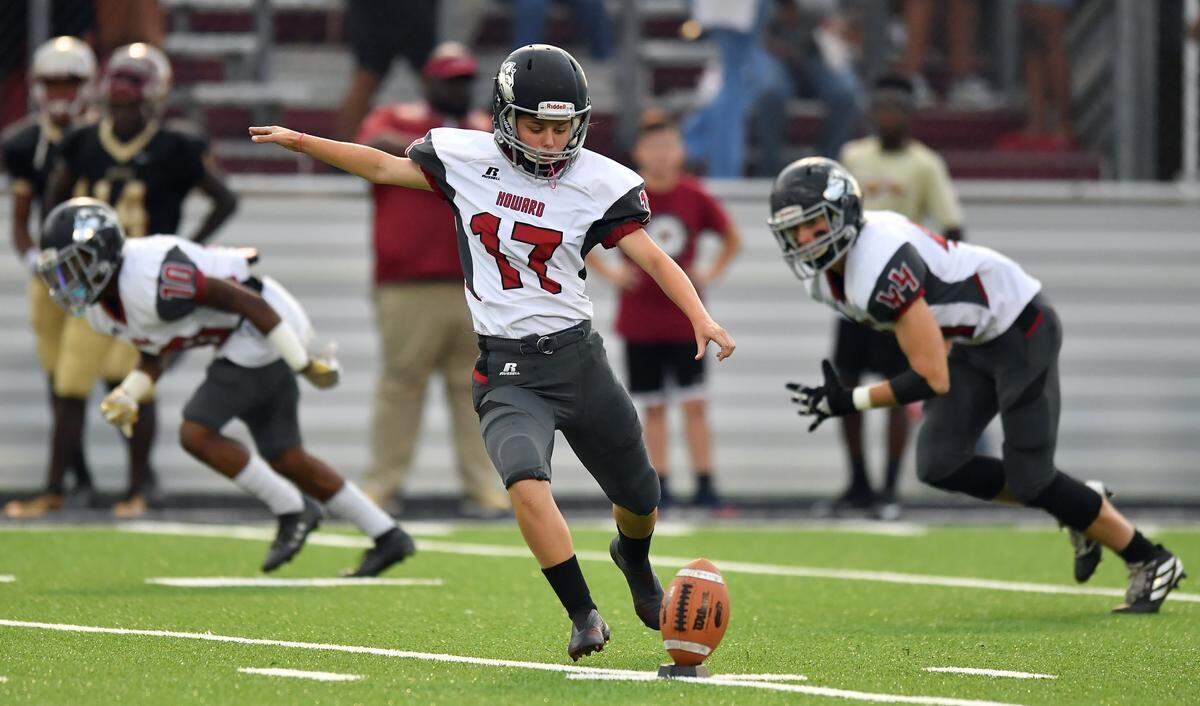Howard High Senior Elizabeth Rodenroth kicks off in the Huskies match-up against Westside High School Sept. 13, 2019.