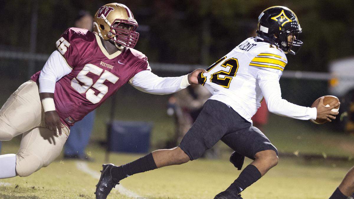 Defensive tackle Kareem Warren (55) and the Westside Seminoles defense have allowed just 22 points this postseason.