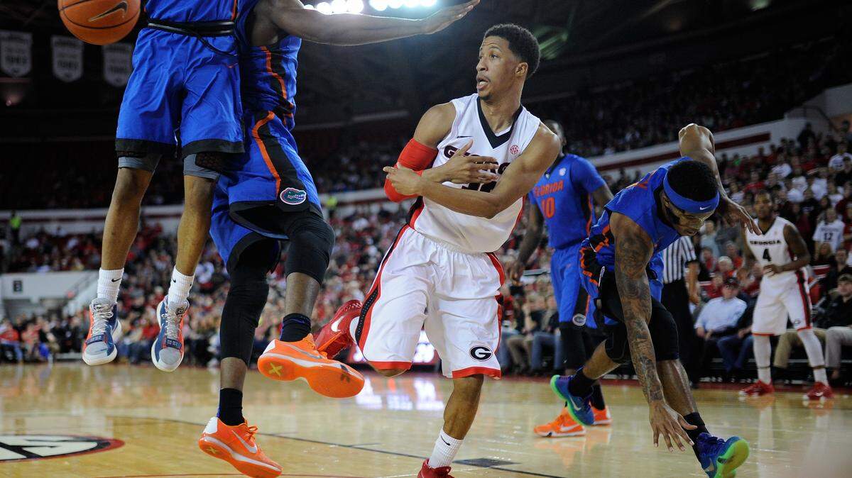 Georgia guard J.J. Frazier (30) passes the ball near the baseline during the second half of an NCAA college basketball game between Georgia and Florida on Tuesday Feb. 16, 2016, in Athens, Ga. Florida won 57-53. (AJ Reynolds/Athens Banner-Herald via AP)