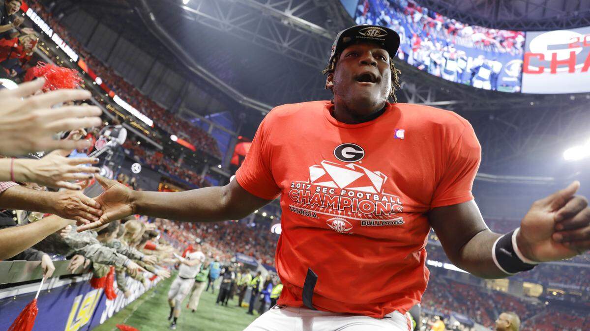 Georgia offensive lineman Isaiah Wilson celebrates after his team defeated Auburn in the SEC Championship.