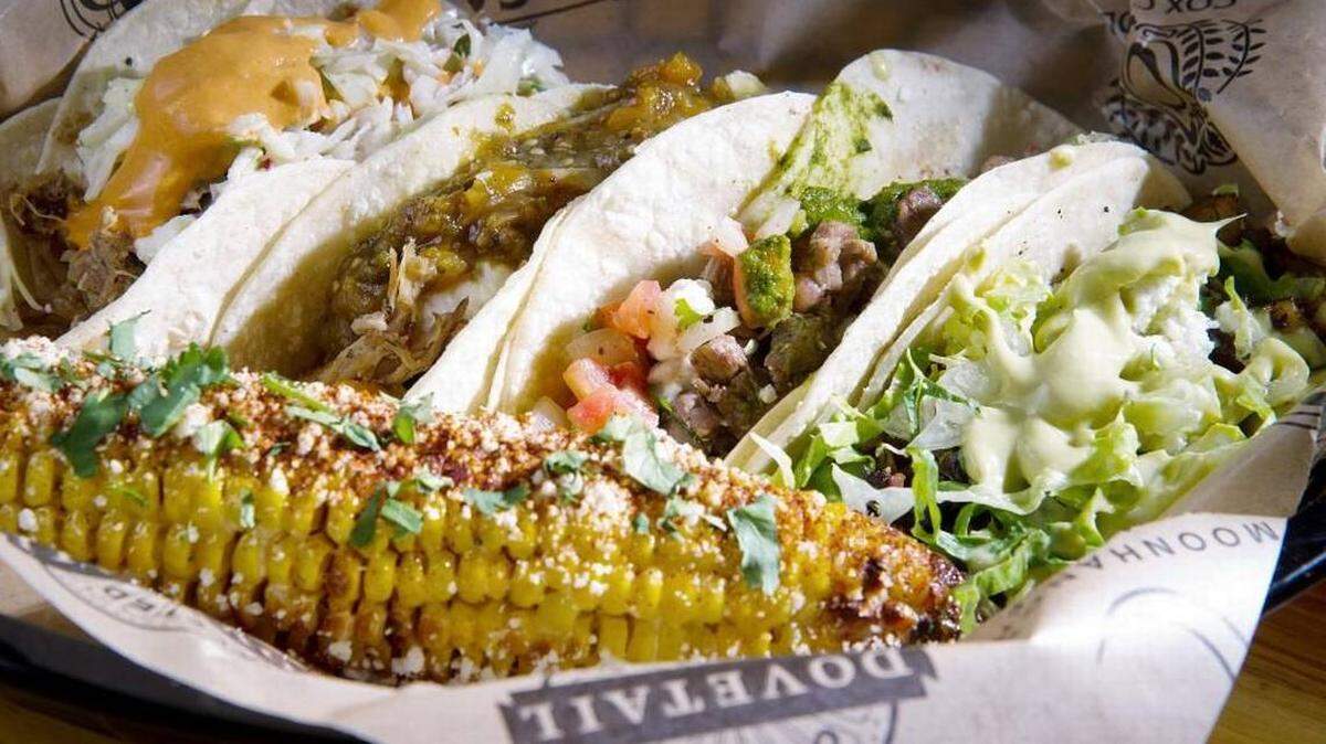 Menu choices at El Camino Taqueria and Cantina include a variety of tacos, from left, the Laredo, Good Shepherd, Ranchero and Rally Sport. Served with them is Mexican sweet corn.