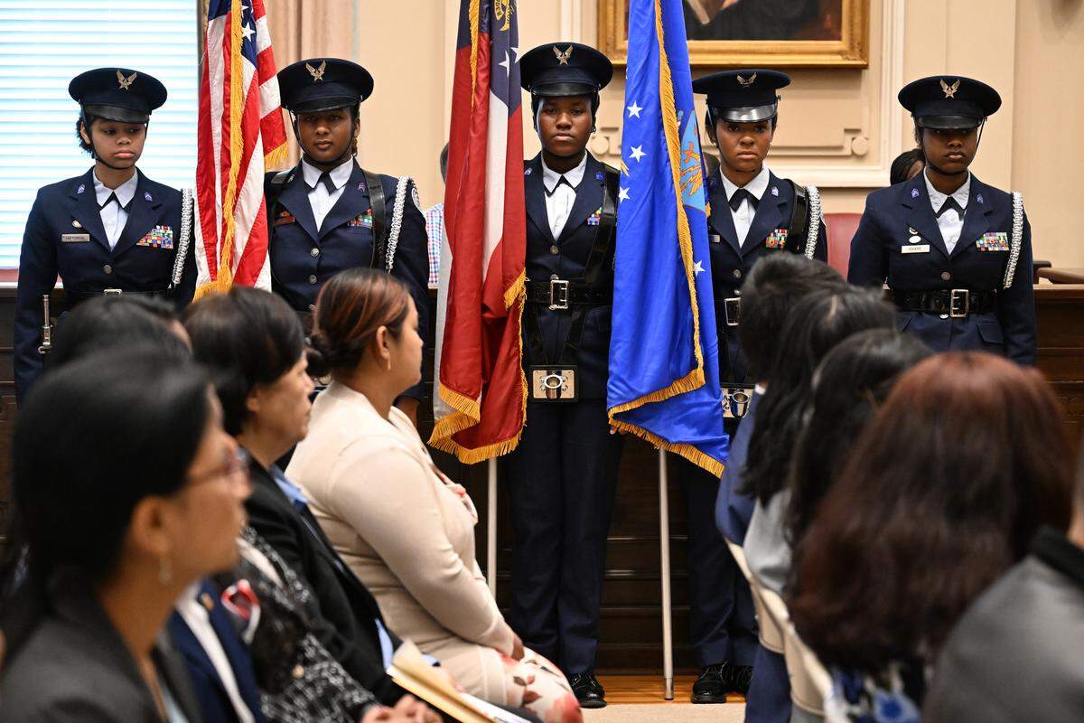 Howard High School ROTC Color Guard members hold flags during a naturalization ceremony on Wednesday, April 8, 2026, at the Bootle Federal Courthouse in Macon, Ga. Seventeen petitioners became United States citizens in Macon, representing 11 different countries and traveling from across Georgia for the ceremony.