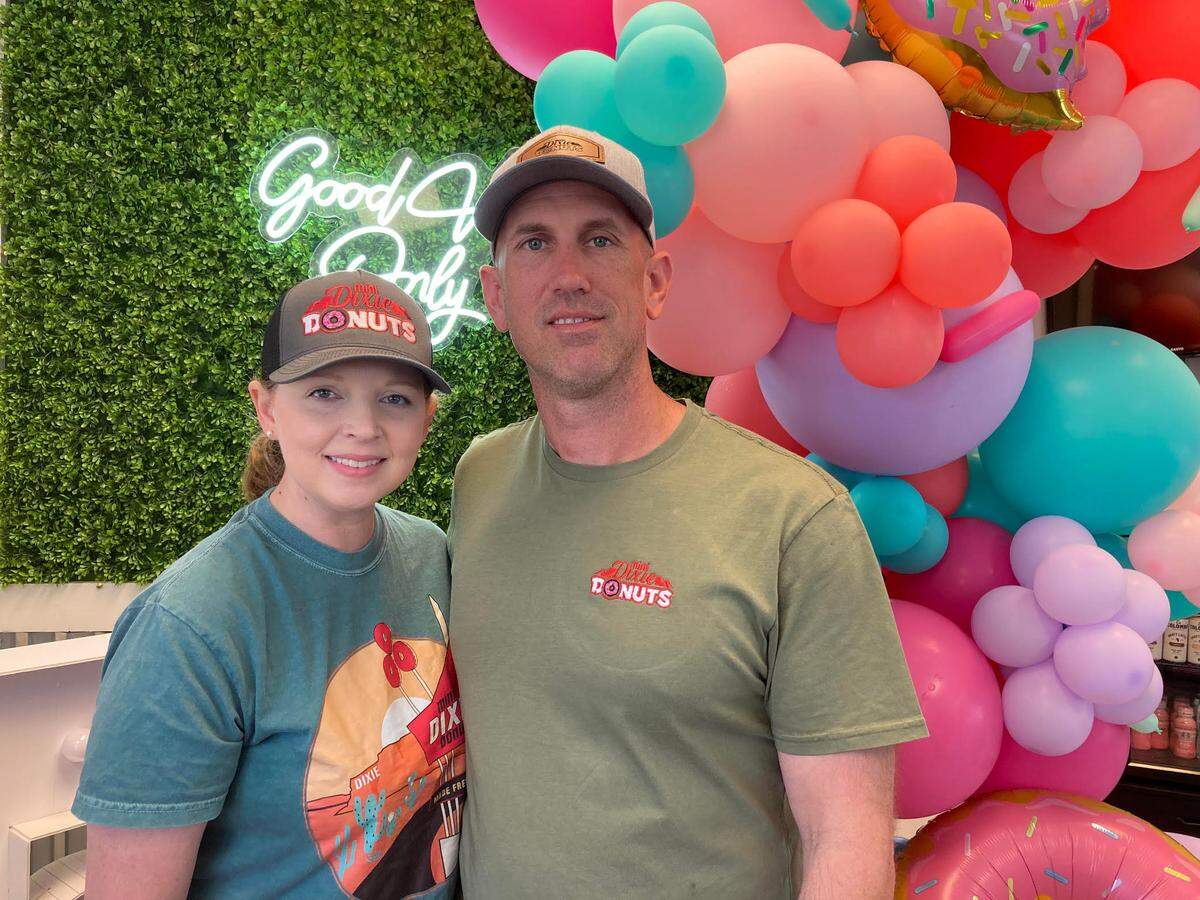 Ashley James, left, started Mini Dixie Donuts in Warner Robins in April 2020. Her husband, Eric James, right, often helped out at the popular doughnut spot.