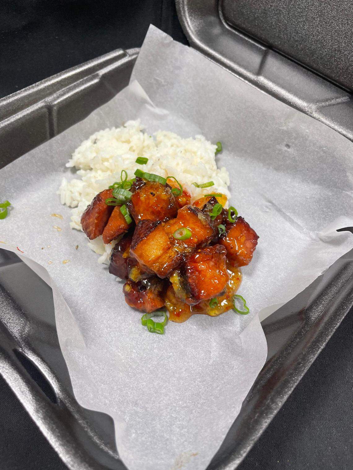 Smoked port belly with peach jalapeno glaze over fried rice from the Root 76 Cuisine food truck soon to be in operation.