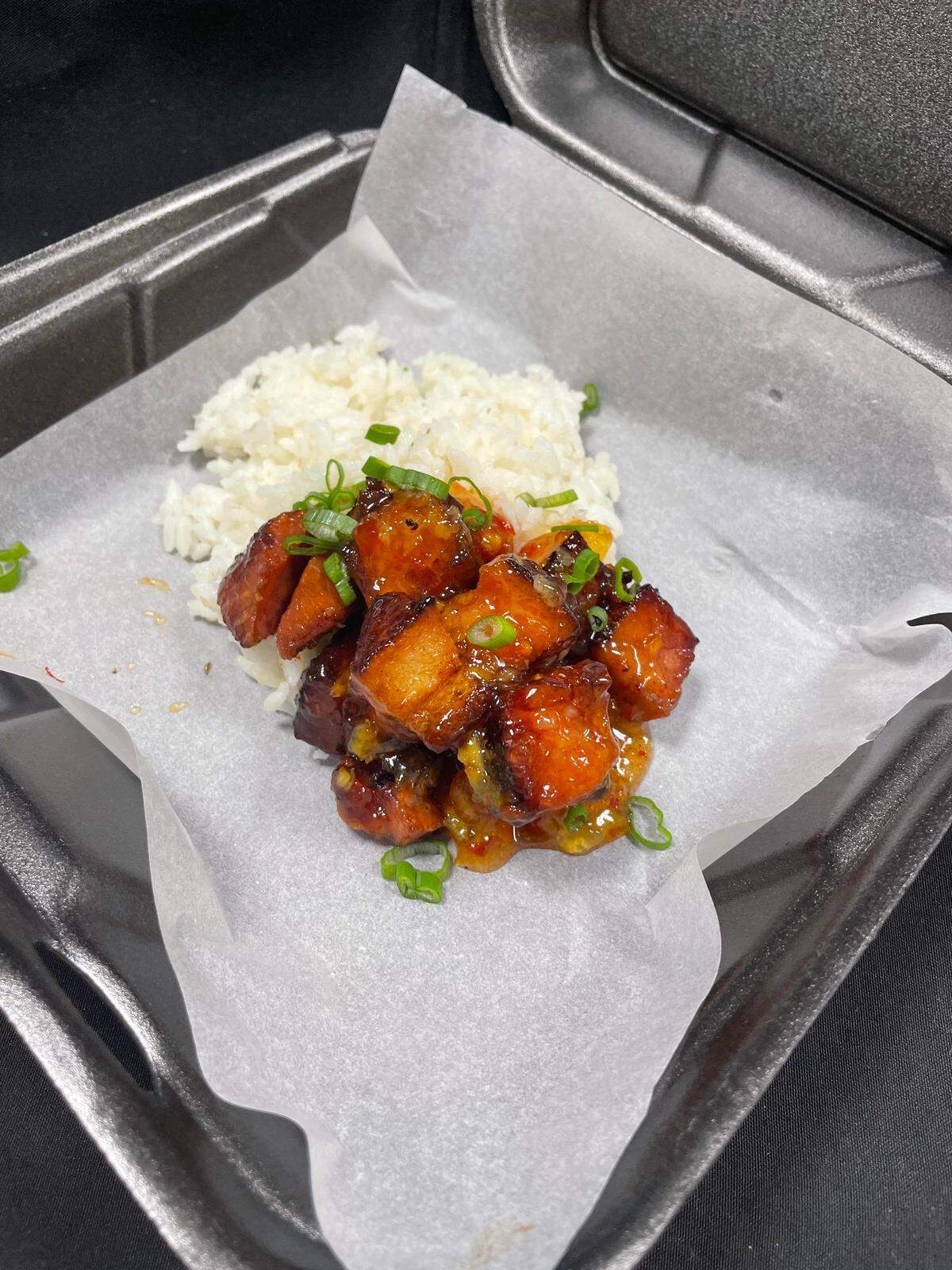 Smoked port belly with peach jalapeno glaze over fried rice from the Root 76 Cuisine food truck which is expected at the International City Experience in Warner Robins on Sept. 7.