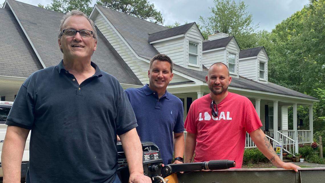 From left: Eddie Jones, with sons Ben and Dan in front of “The Aunt Bee” boat.