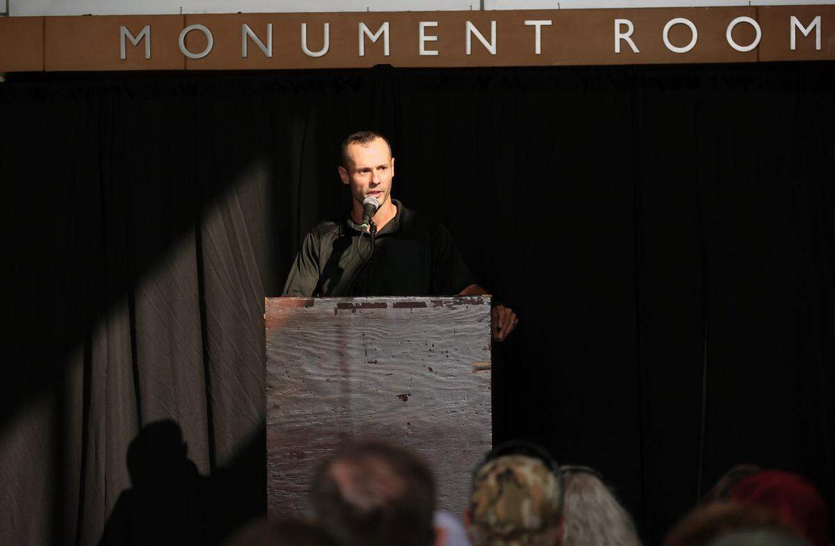 New Macon Head Coach Dave Pszenyczny addressed the crowd during a team press conference at the Macon Centreplex in early August.