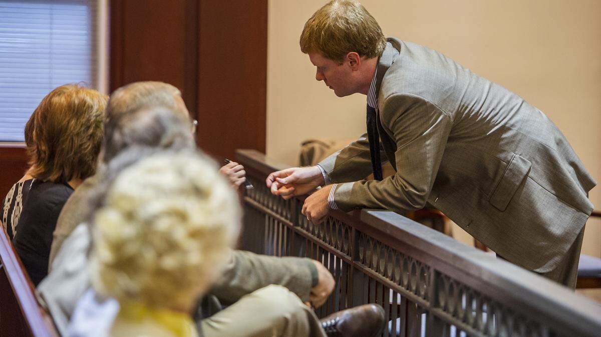 William Lawrence Carpenter, 30, speaks to his supporters in the courtroom before the start of his trial last month.