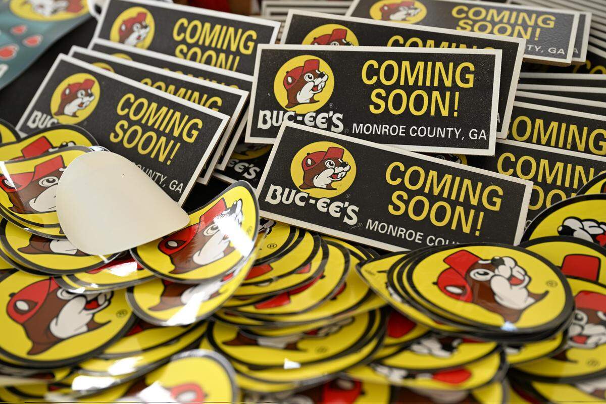 Complimentary stickers and magnet sit on a table at the Monroe County Buc-ee’s groundbreaking on Tuesday, April 7, 2026, in Forsyth, Georgia. The fourth Buc-ee’s location in Georgia will be located off of I-75 South in Monroe County and is expected to open in the next 14 to 16 months.