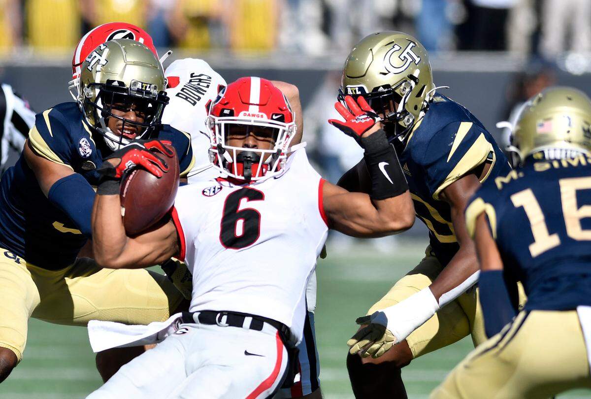 Georgia running back Kenny McIntosh (6) is knocked out of bounds in the first half of the Bulldogs 45-0 win over Georgia Tech Saturday in Atlanta.