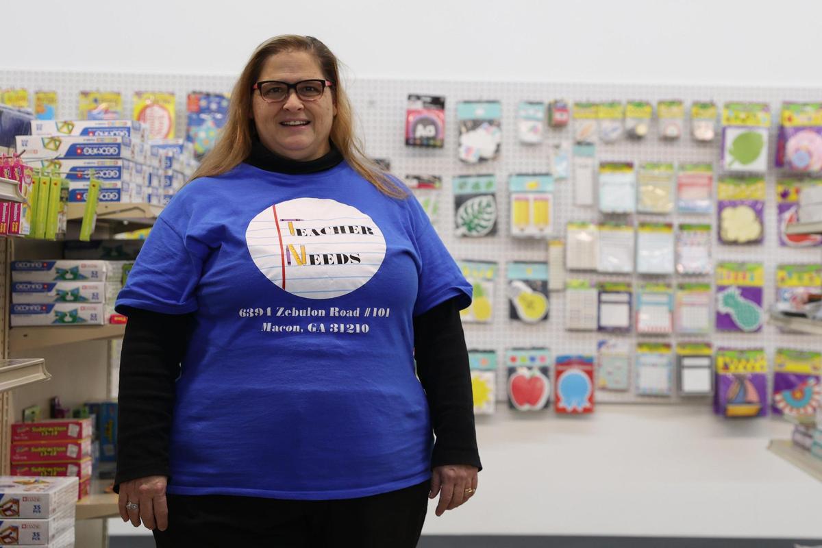 Teacher Needs co-owner Roxanne Oppy poses in an aisle at Teacher Needs on Friday, Feb. 14, 2025, in Macon, Georgia. Teacher Needs held a soft opening last Saturday and is Macon’s only education store, after taking over the inventory from the historic GA School Supply Store in Macon.