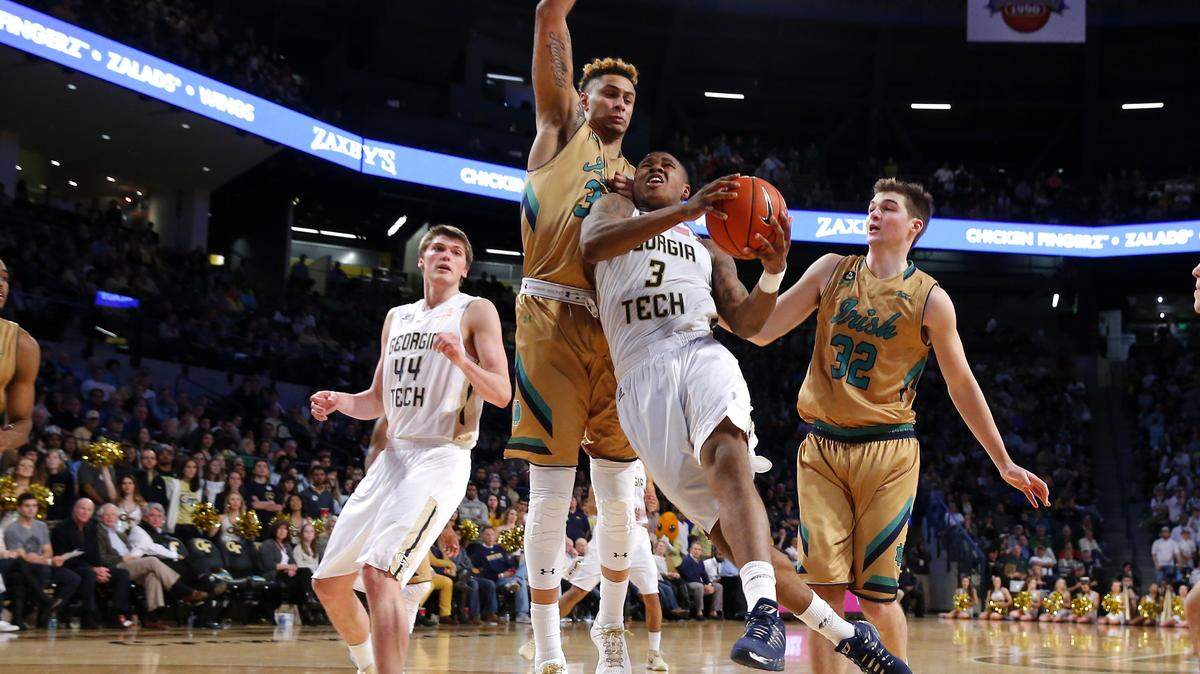 Georgia Tech guard Marcus Georges-Hunt (3) drives to the basket under Notre Dame forward Zach Auguste (30) during the second half of an NCAA college basketball game in Atlanta, Saturday, Feb. 20, 2016. Georgia Tech won the game 63-62. (AP Photo/Todd Kirkland)
