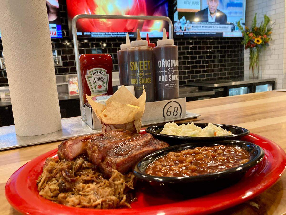 A pick two at Sonny’s BBQ of pulled pork, sweet and smokey ribs, BBQ beans, coleslaw and cornbread.