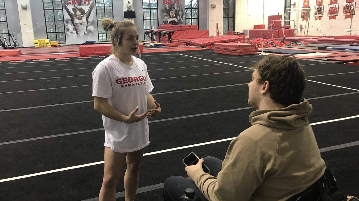 Georgia athletics beat reporter Brandon Sudge, right, interviews GymDog Marissa Oakley in Athens, Ga.