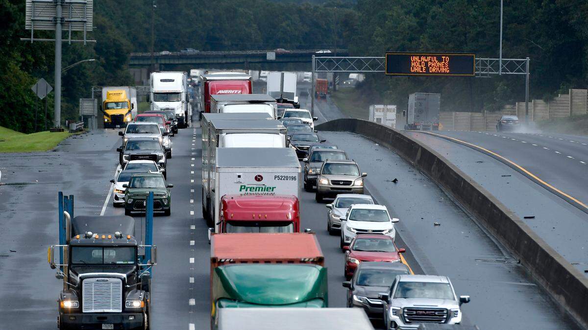 View from Peake Road bridge as an overturned tractor-trailer shut down all northbound lanes of I-475 just north of Zebulon Road in west Bibb County Wednesday afternoon. Georgia Department of Transportation said the left-hand lane had reopened.